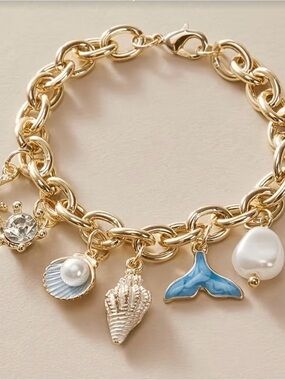 Gold-Tone Sea Charm Bracelet with Blue Enamel Whale Tail